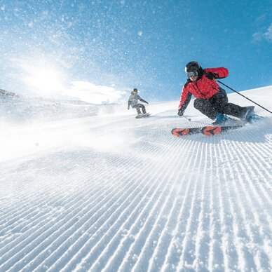 Skiers on the ski slopes in Matterhorn Glacier Paradise
